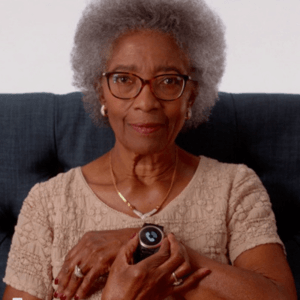 A woman staring an emergency call on a Kanega Watch
