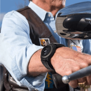 A man riding a motorcycle while wearing a Kanega Watch