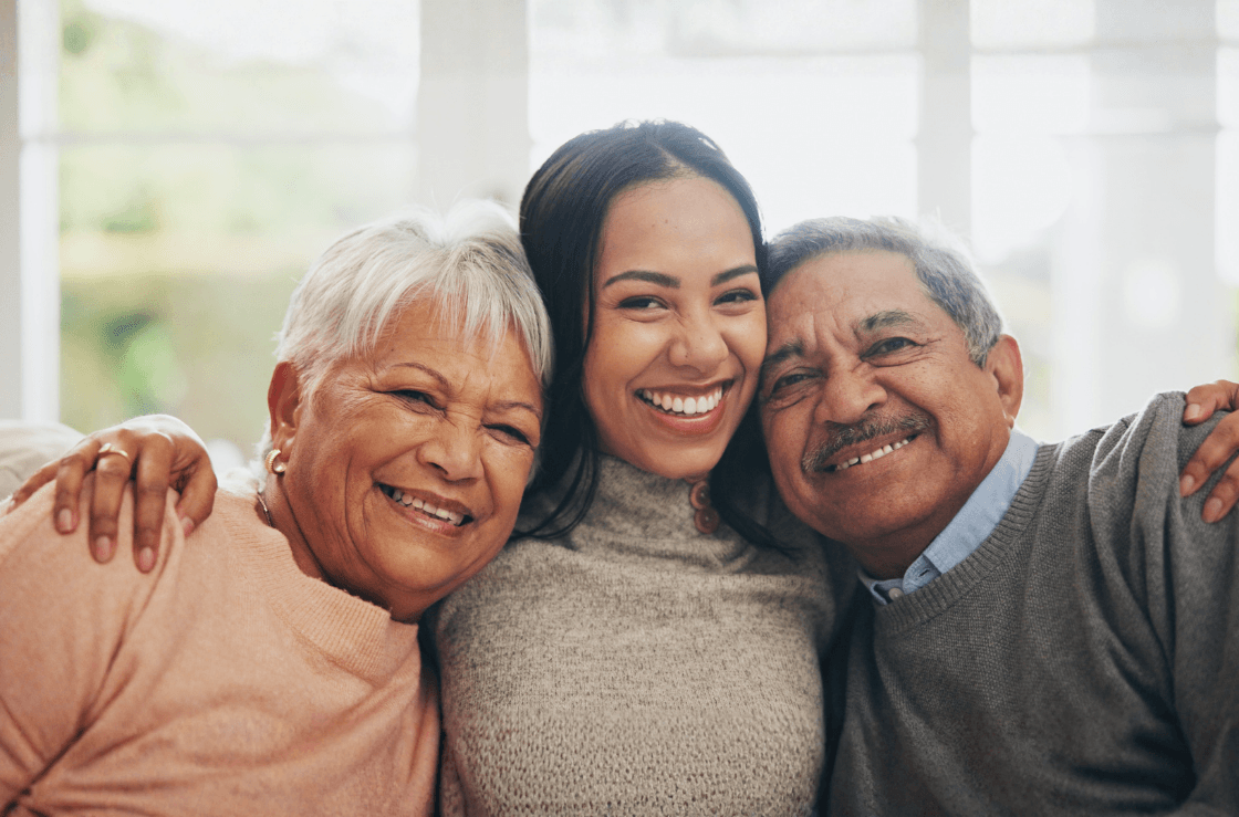 An elderly caregiver daughter with her senior parents.