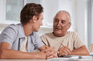An older man and his son having a discussion.
