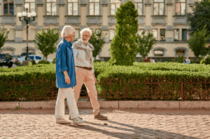 A man and a woman walk on a path.