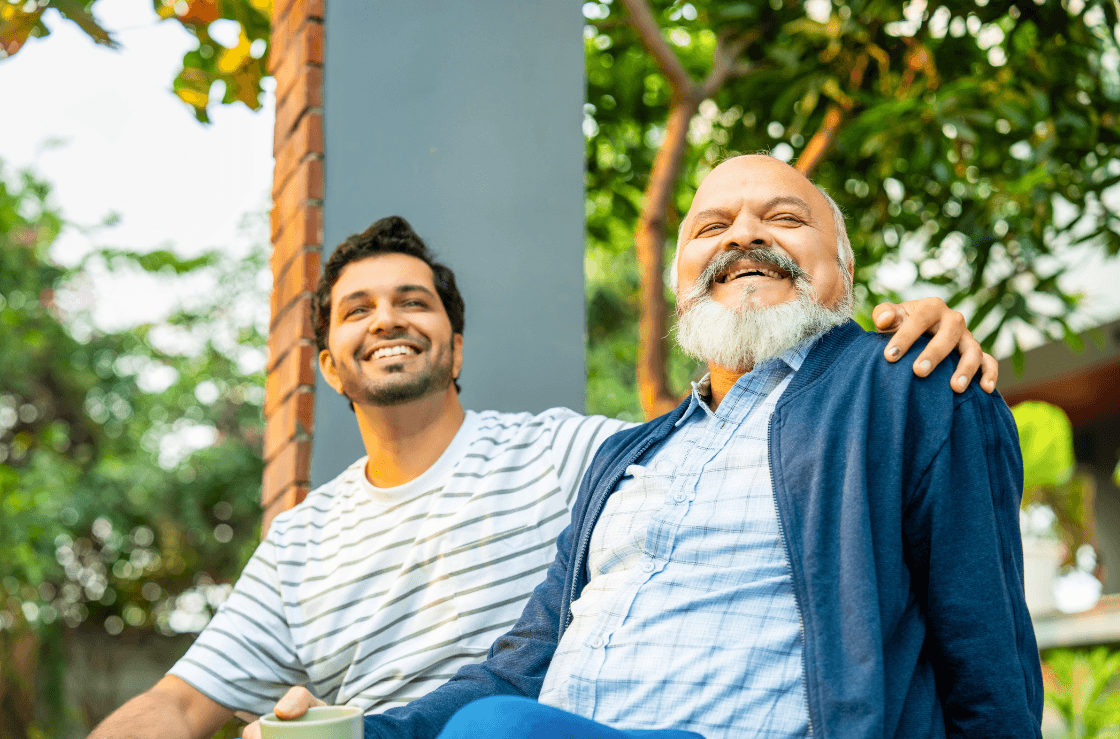 Father and son sitting down.