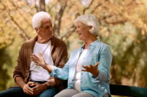 elderly couple talking with excitement and joy about saftey