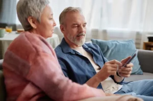 connecting with family through the phone to stay in touch.