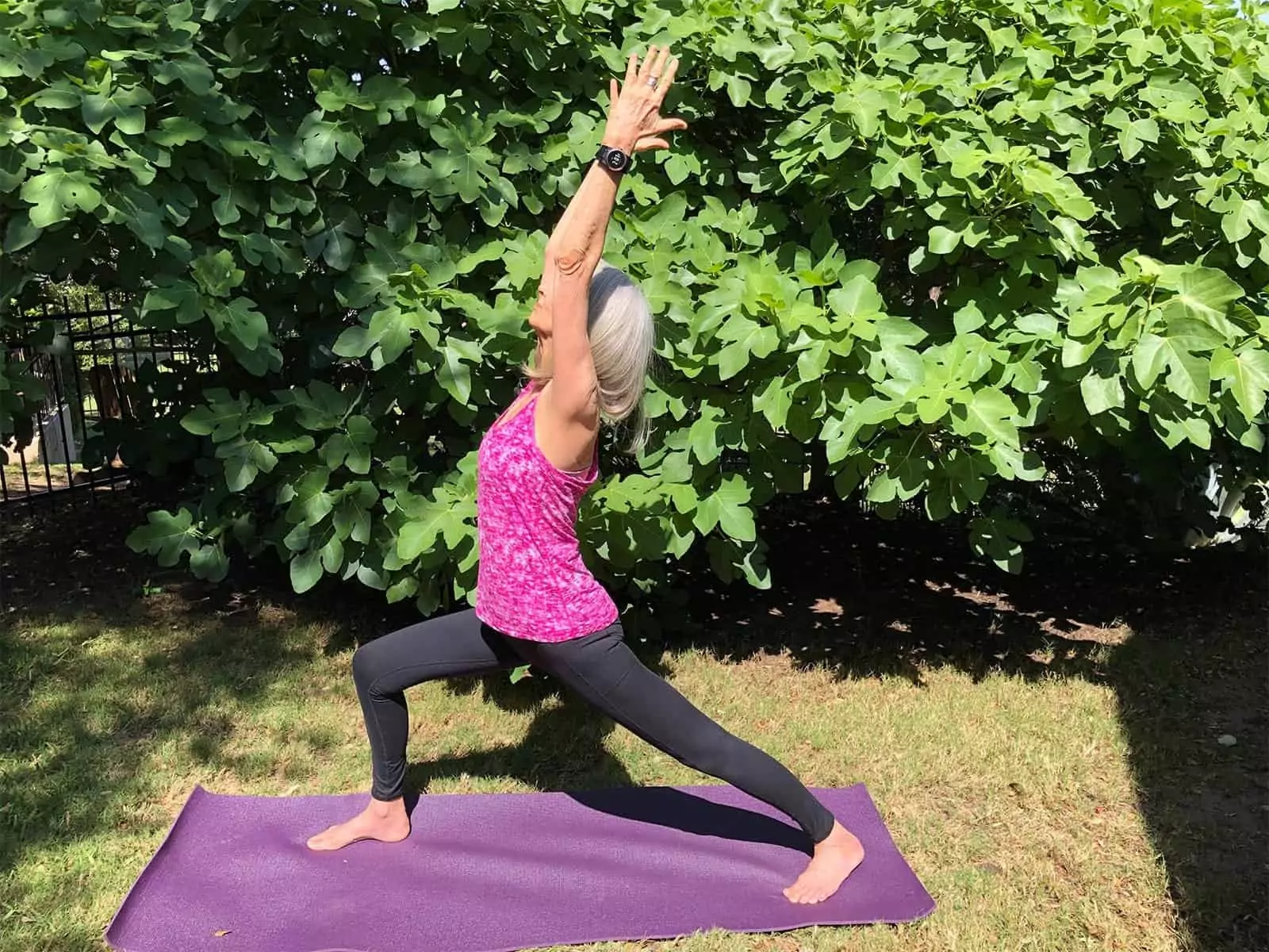 Woman doing yoga outside wearing the Kenga Watch