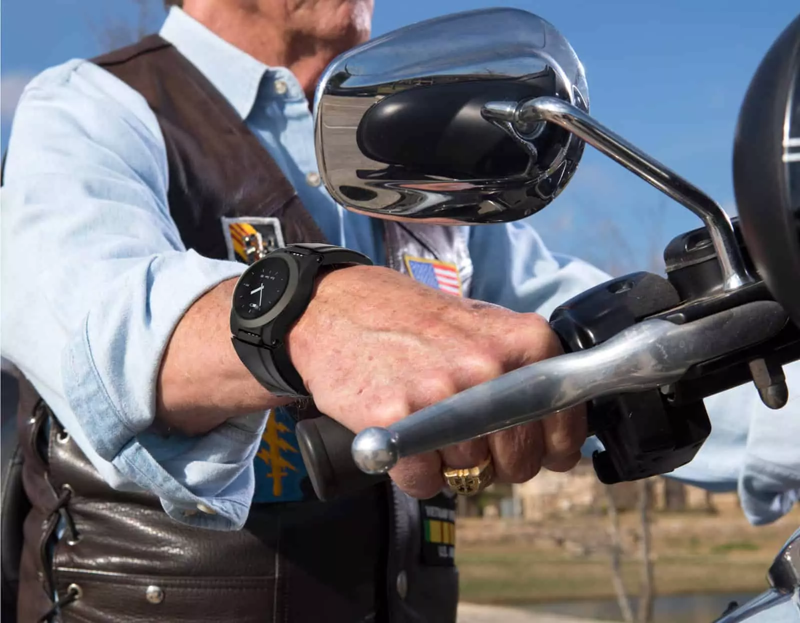 Man on motorcycle wearing a Kanega watch