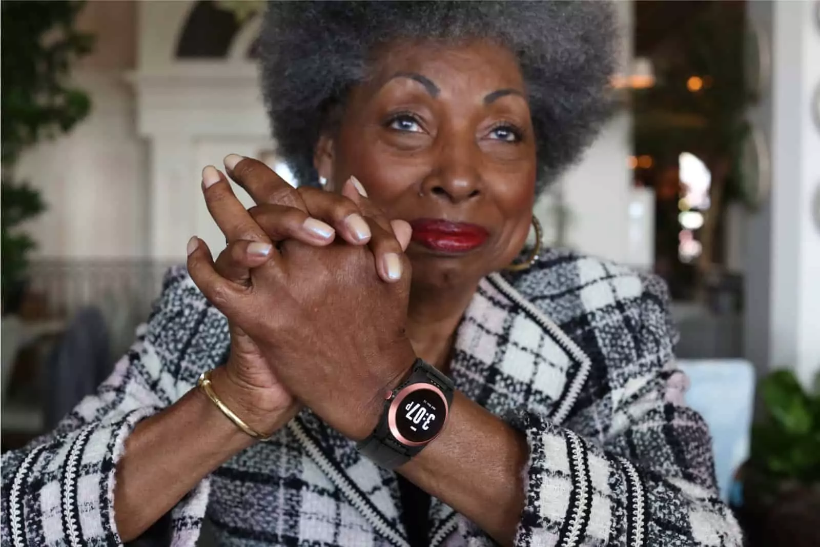 Lady sitting, wearing a Kanega Watch